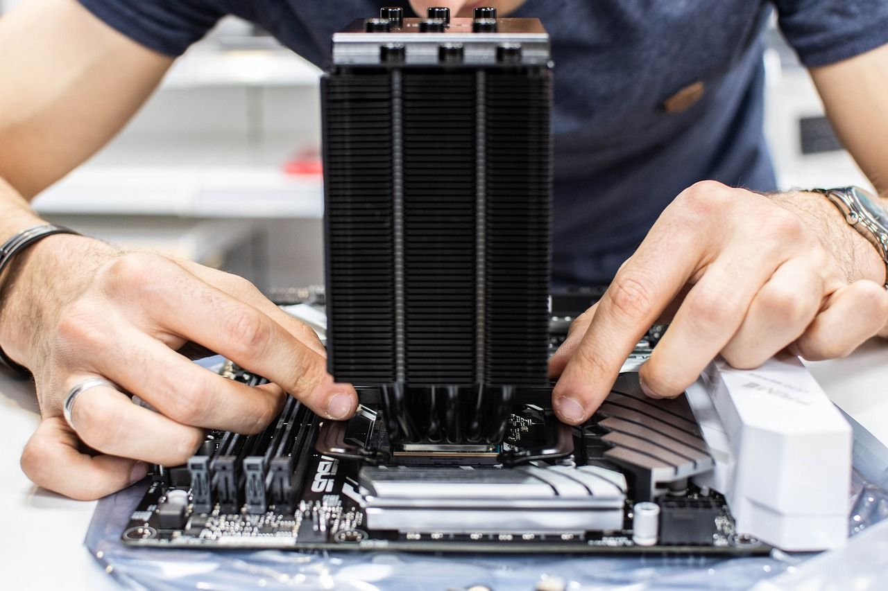 A tidy workbench with PC components laid out for assembly